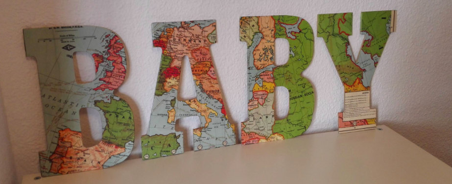 My sister made these for our nursery using wooden letters, mod podge, and world maps!